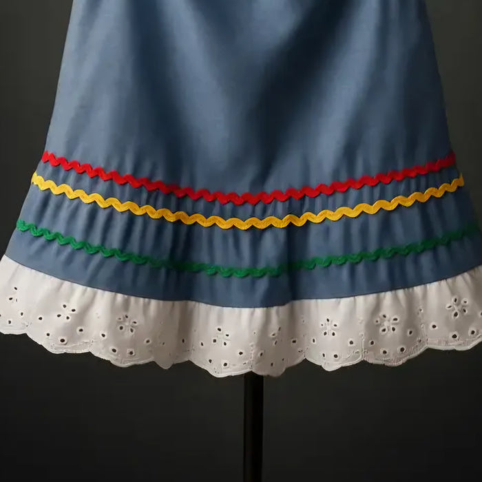 Rouleaux de tissu Karabela bleu et galons rikrak pour couture haïtienne 